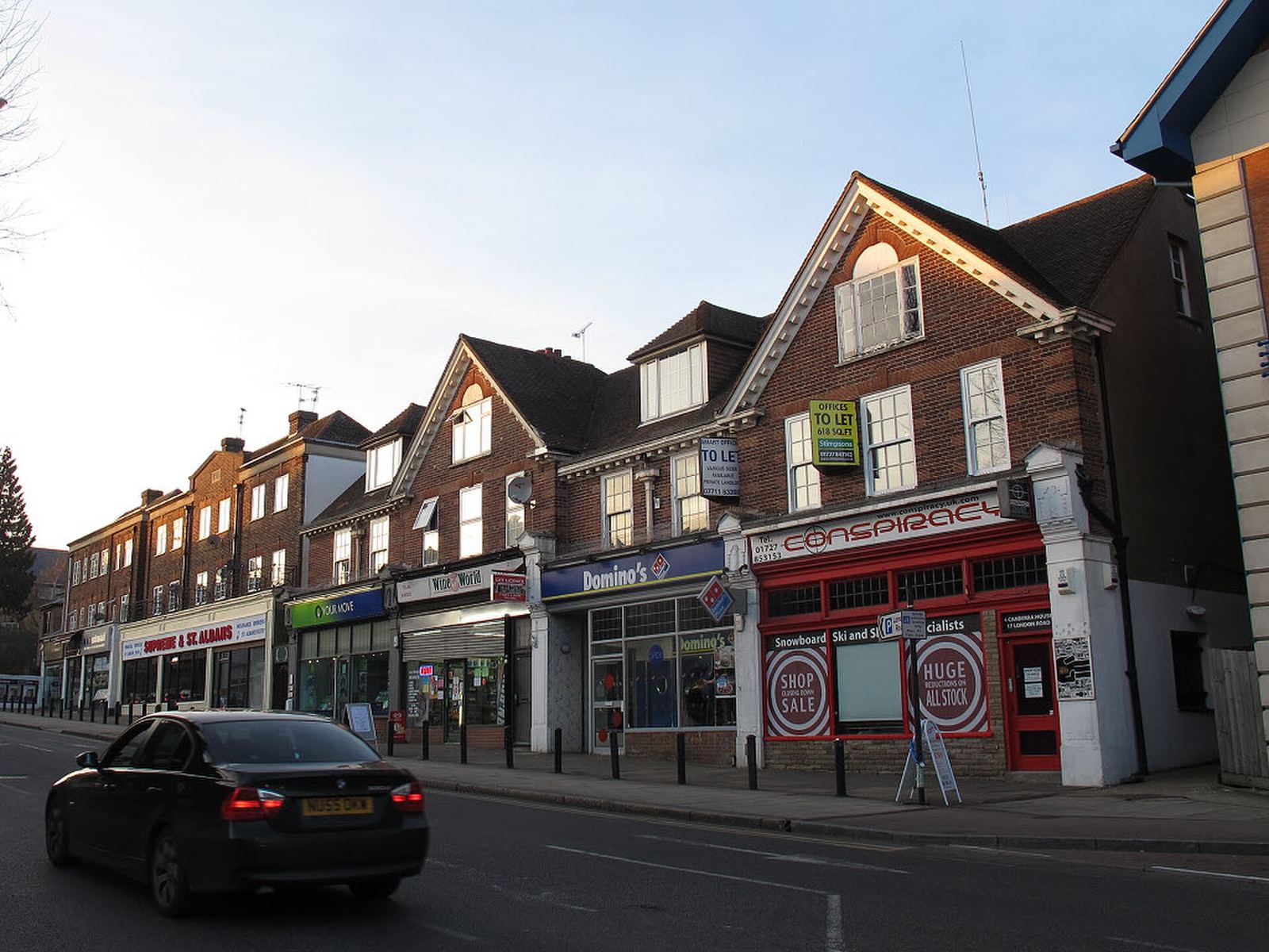 London Road shopfronts in St Albans, looking towards the Cathedral, a few doors up from Longmire House.